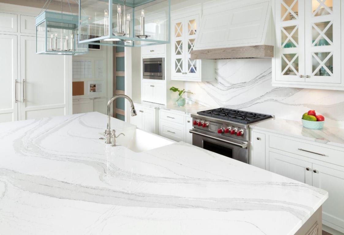 Clean white kitchen designs by Surfaces PCB in Florida